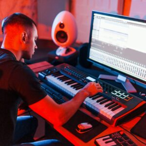 Professional sound engineer working and mixing music indoors in the studio